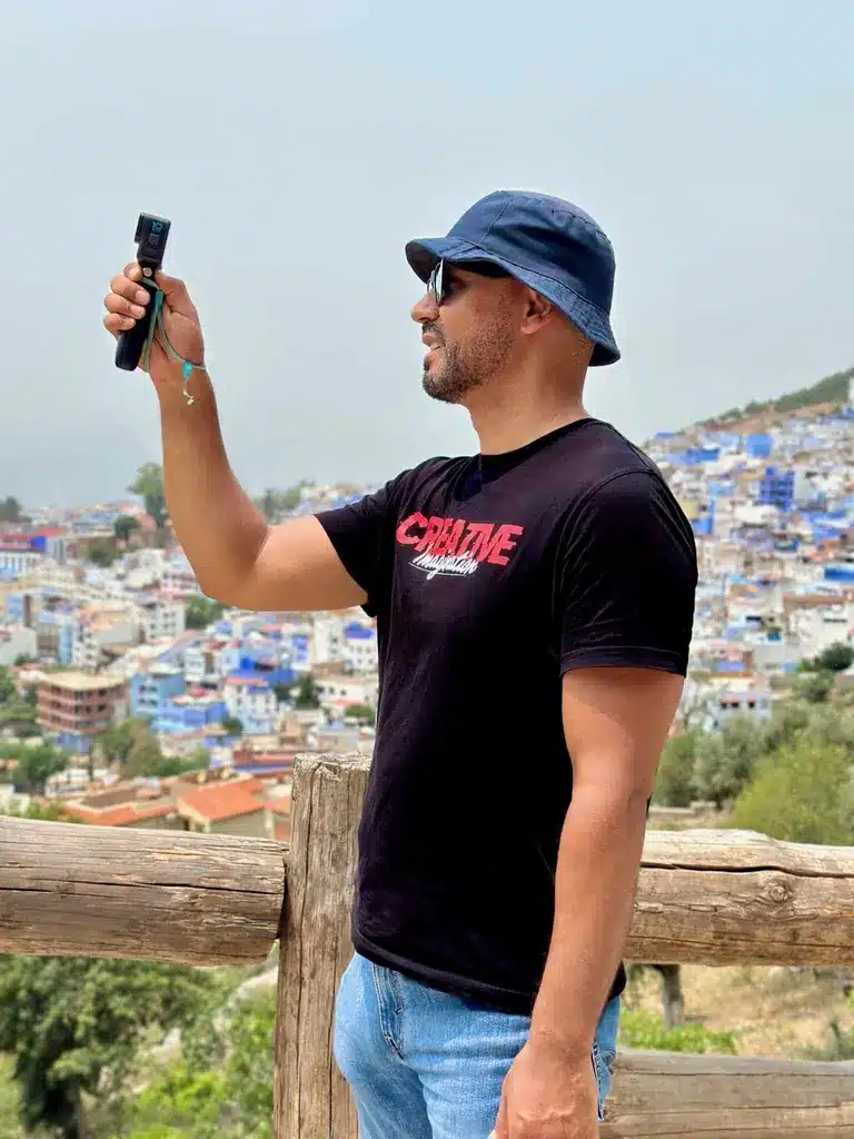 Majdi filming on the road
